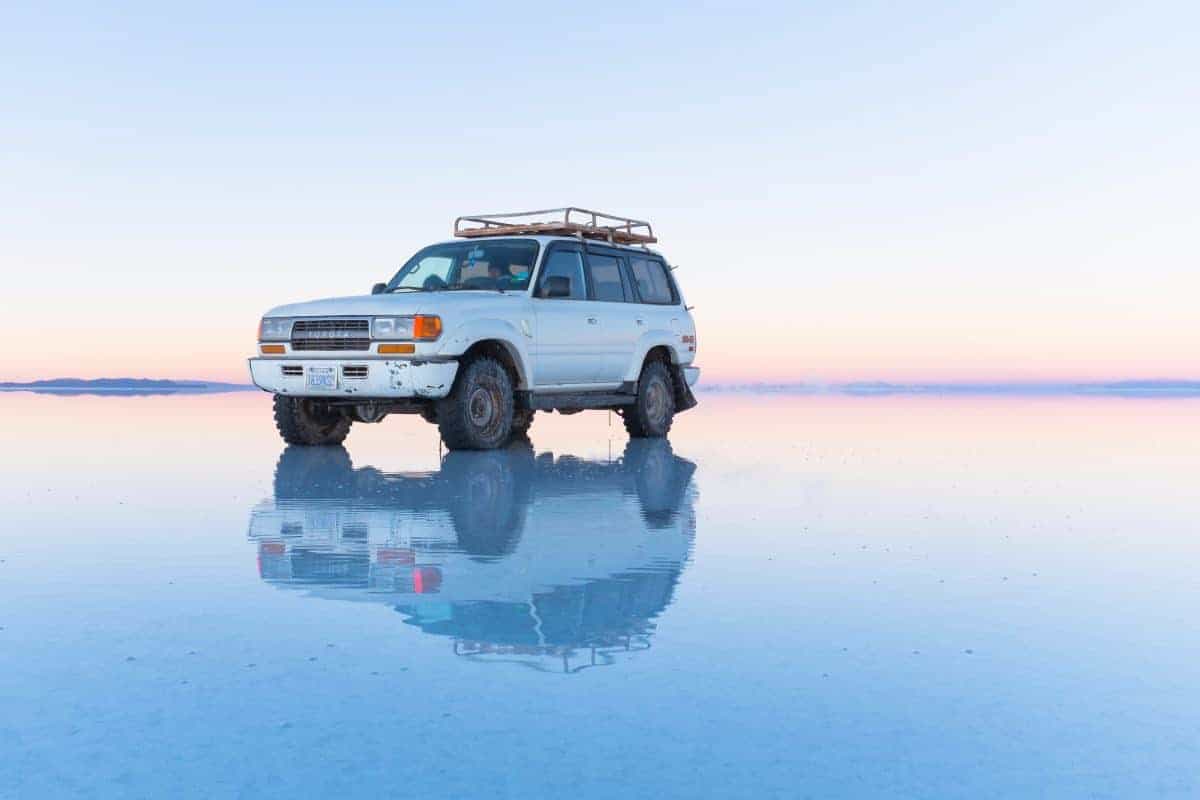 Jeep on the salt flats of Uyuni, Bolivia.