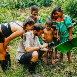 Visitors to Cuyabeno with local children