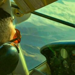 Pilot flying over Nasca desert